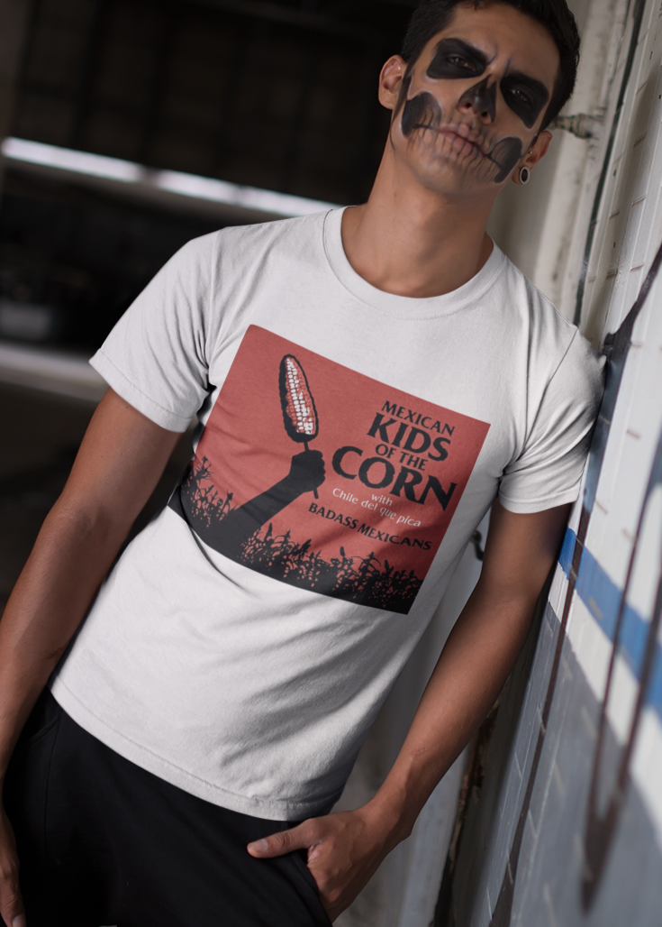 White crew-neck t-shirt featuring a red retro movie poster graphic with a hand holding a spiced corn on a stick above a cornfield silhouette.
