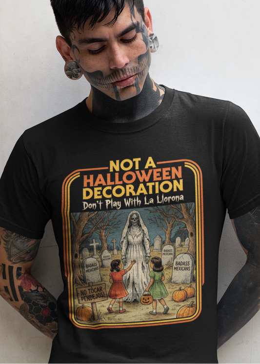 Black t-shirt featuring a retro horror poster illustration of La Llorona in a graveyard above the text "NOT A HALLOWEEN DECORATION Don't Play With La Llorona".