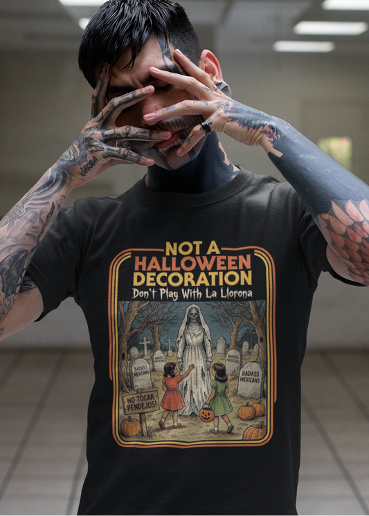 Black t-shirt featuring a retro horror poster illustration of La Llorona in a graveyard above the text "NOT A HALLOWEEN DECORATION Don't Play With La Llorona".