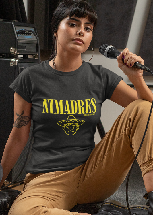 Black crew-neck t-shirt with "NI MADRES" printed in a yellow grunge font above a yellow line-art icon of a smiling man wearing a traditional sombrero.