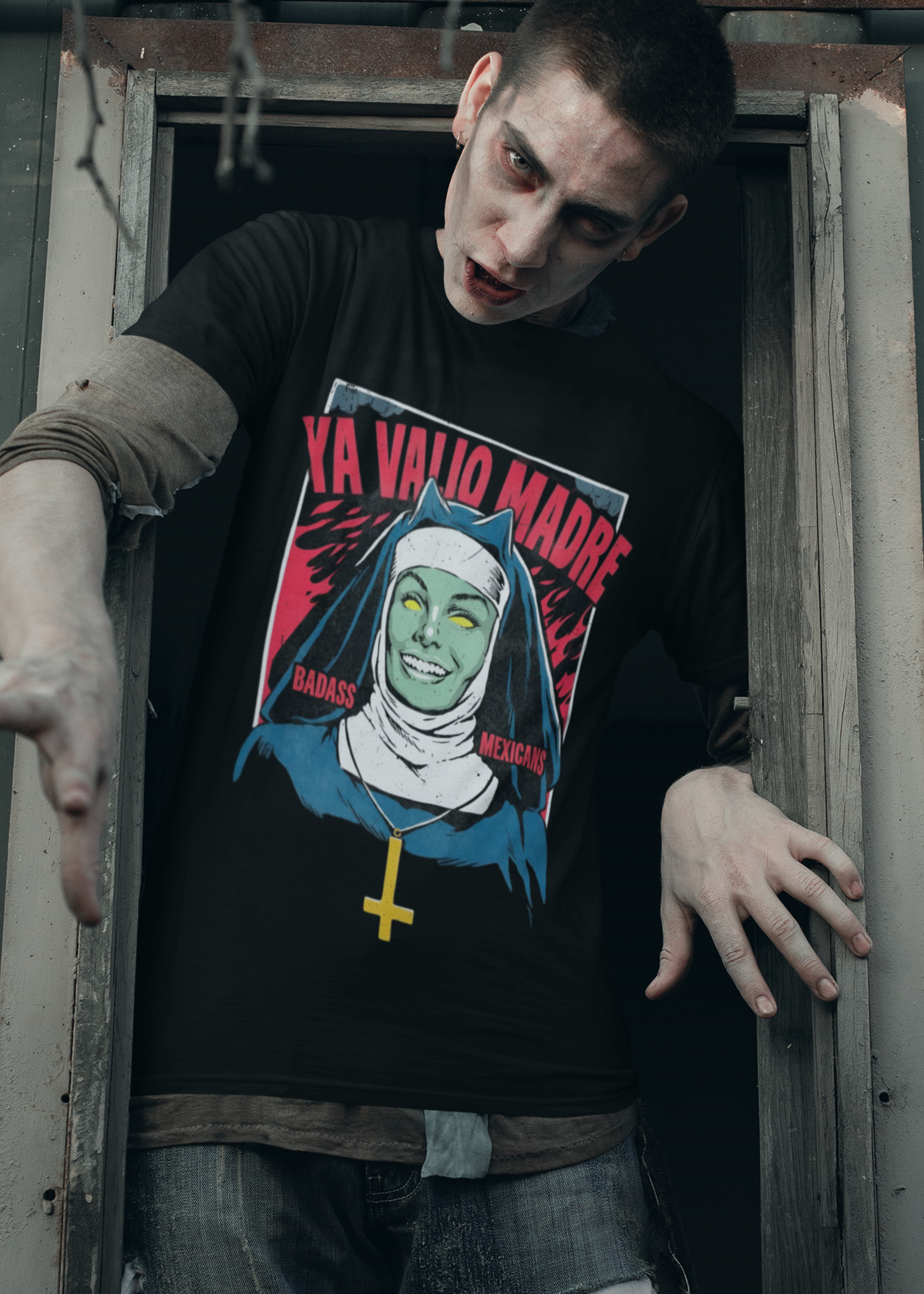 Black t-shirt with a retro comic graphic of a possessed nun and red text reading "YA VALIÓ MADRE".