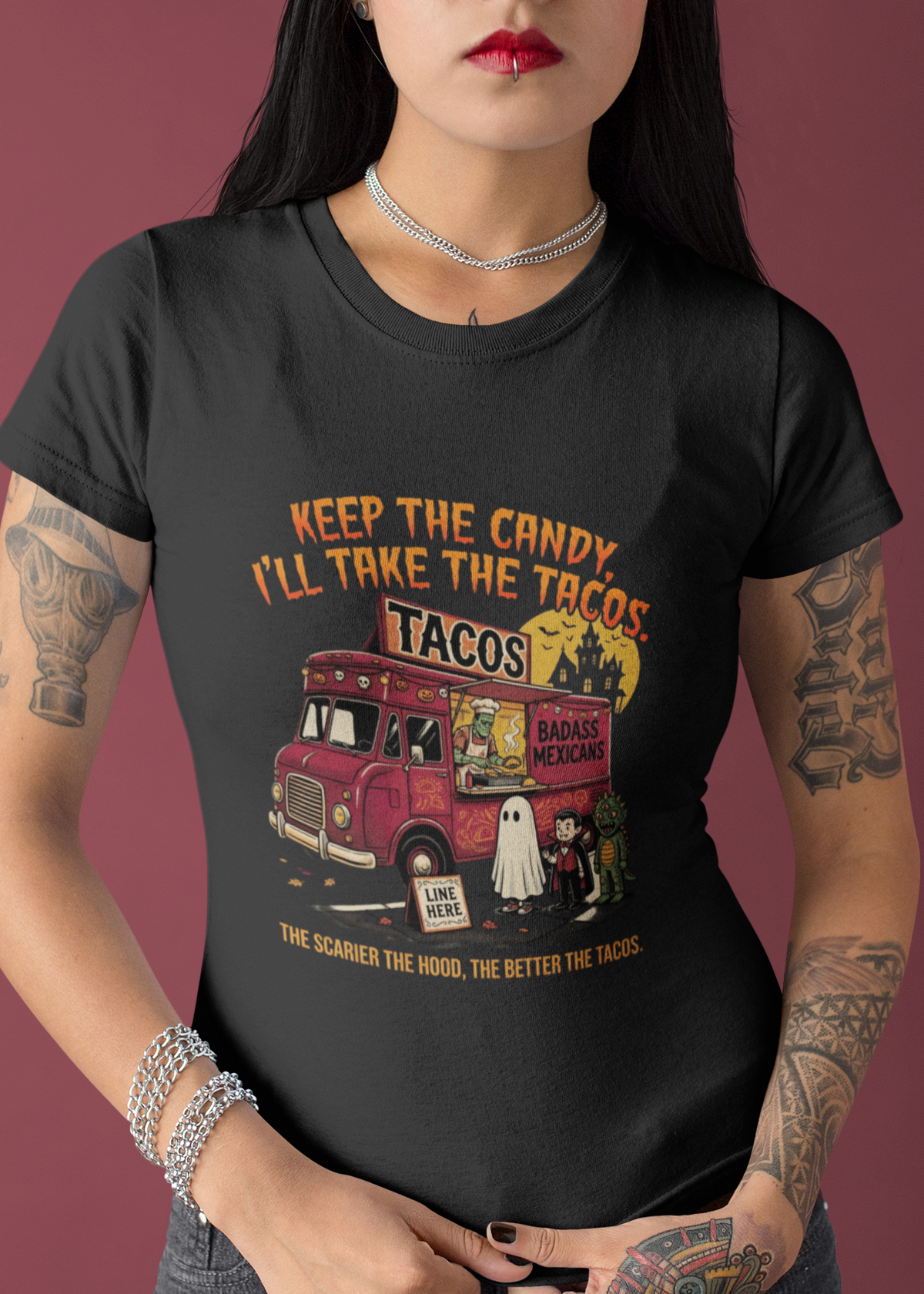 Black t-shirt featuring a spooky taco truck graphic with monsters in line under the text "Keep the candy I'll take the tacos".
