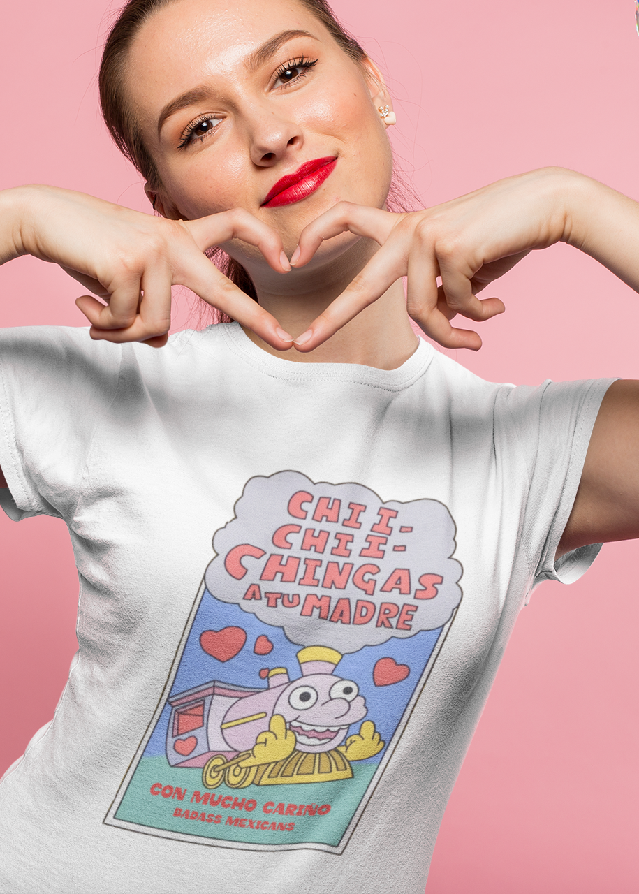Woman wearing white t-shirt featuring a colorful Valentine-style illustration with Spanish text that reads "Chingas a tu Madre" “Con Cariño,” designed as a humorous and playful Mexican-inspired message.