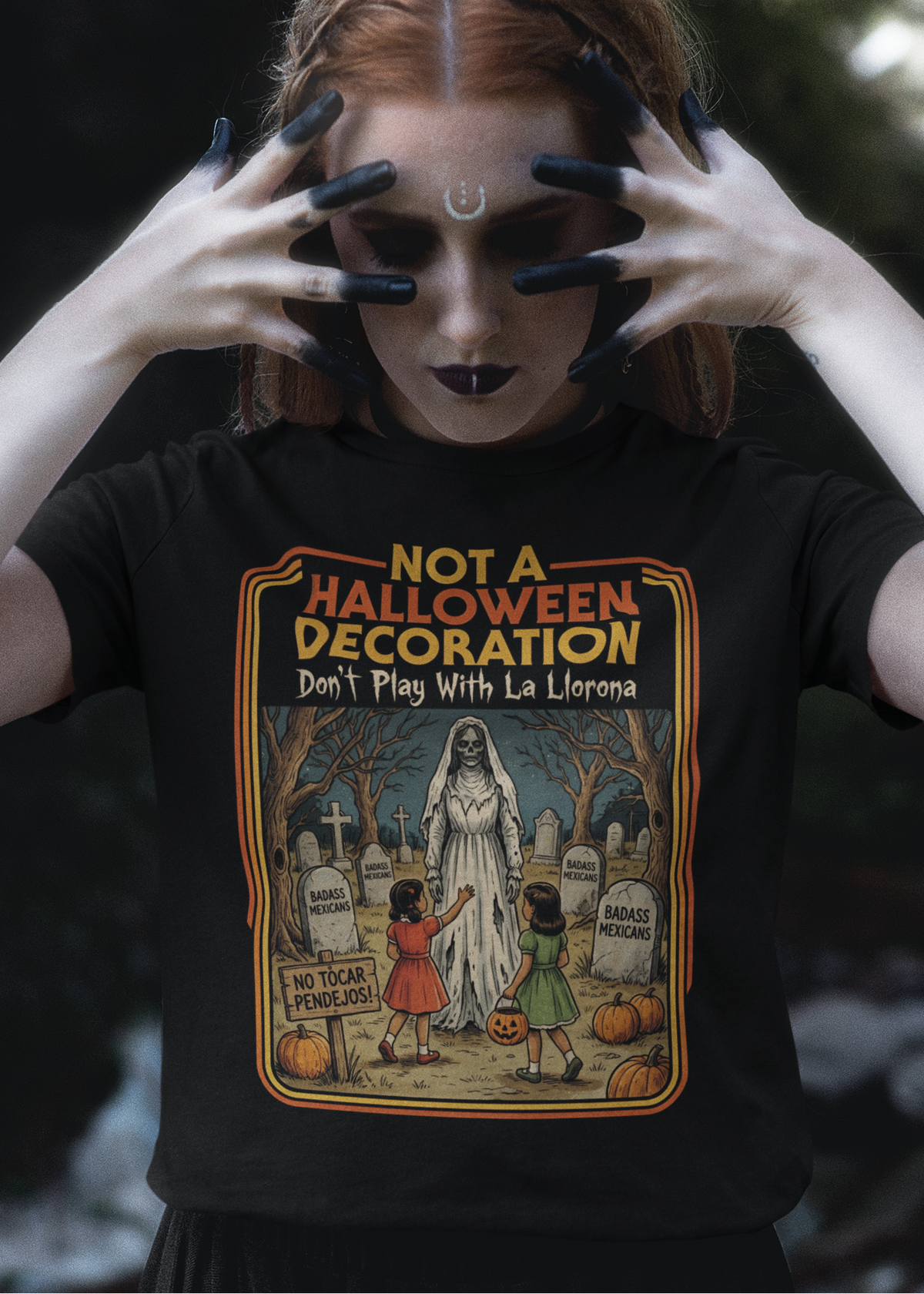 Black t-shirt featuring a retro horror poster illustration of La Llorona in a graveyard above the text "NOT A HALLOWEEN DECORATION Don't Play With La Llorona".