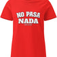 a red t-shirt with the phrase “No Pasa Nada” printed in bold white letters, seated in an arcade environment with colorful lights in the background.