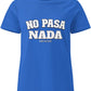 a blue t-shirt with the phrase “No Pasa Nada” printed in bold white letters, seated in an arcade environment with colorful lights in the background.